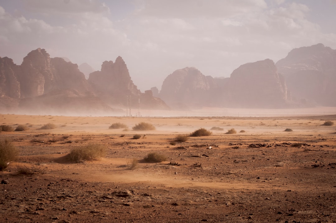 Rain sweeping across a desert mountain landscape