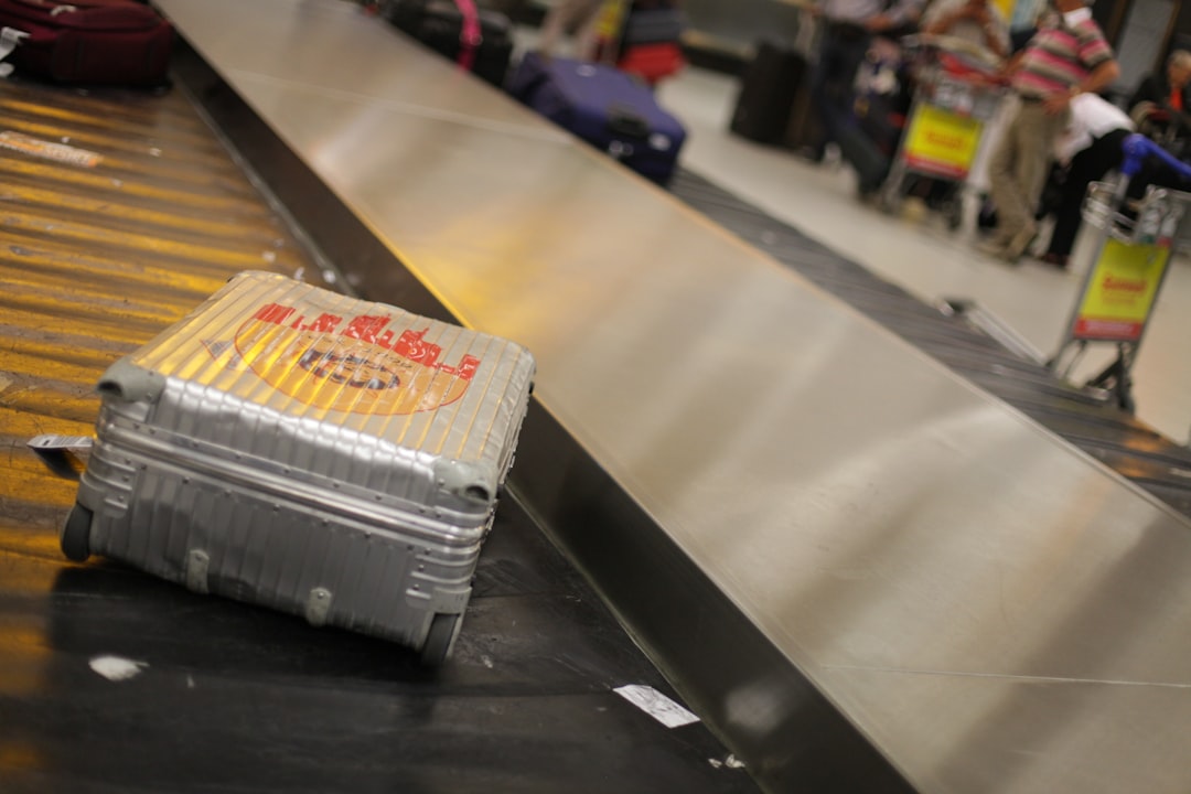 Hard-shell suitcase with luggage tag at an airport