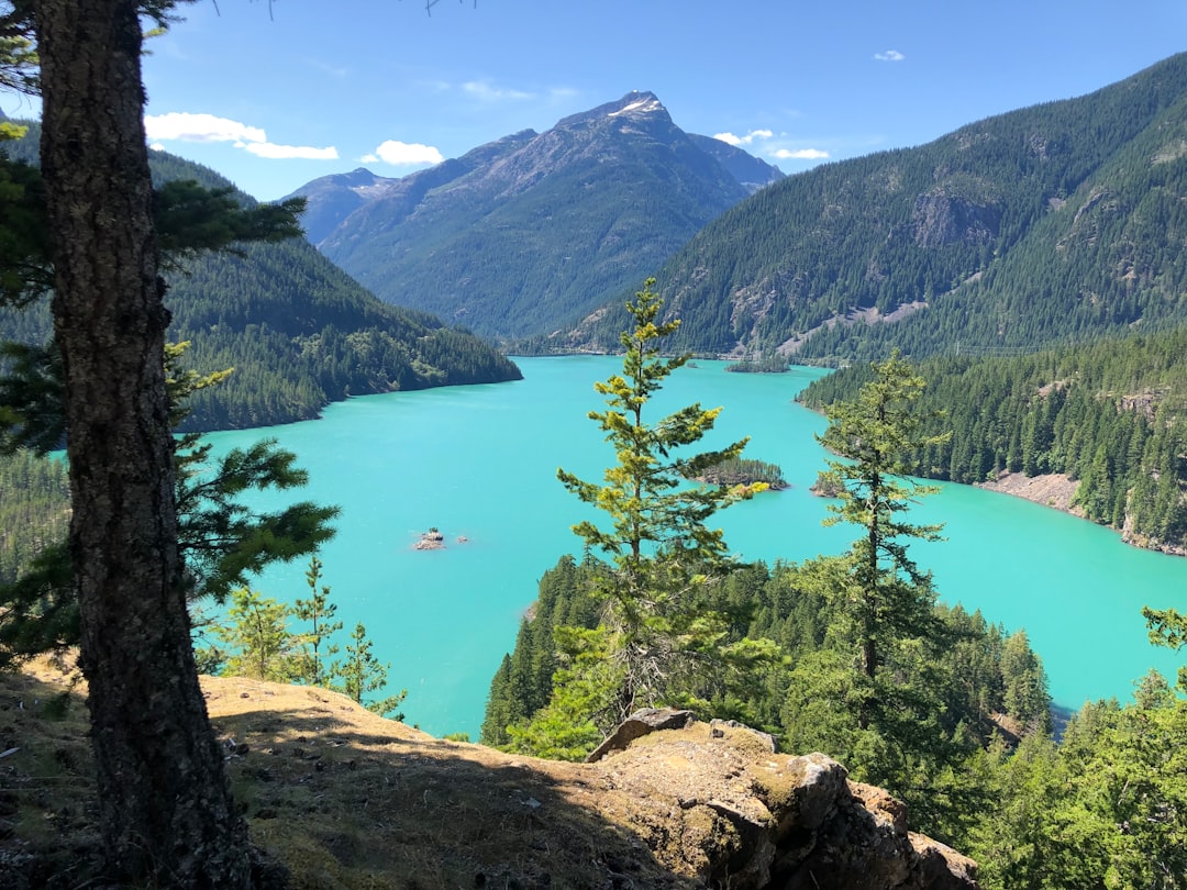Diablo Lake's turquoise glacial water surrounded by forested mountains