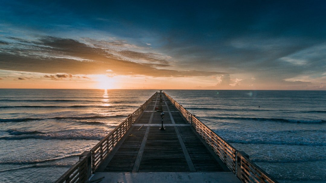 Jacksonville Beach Pier extending over Atlantic Ocean waves