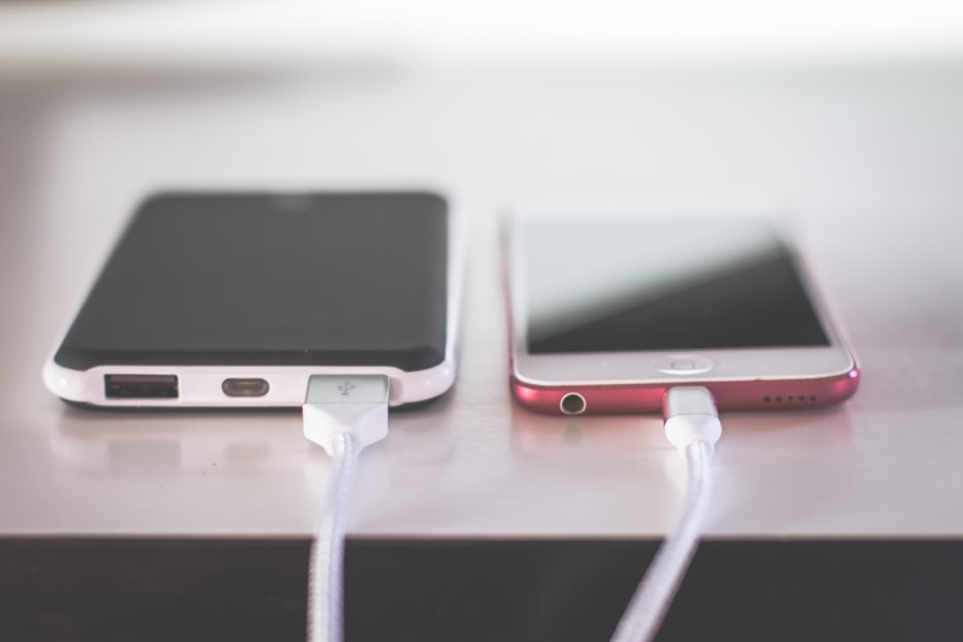 Portable power bank charging a smartphone