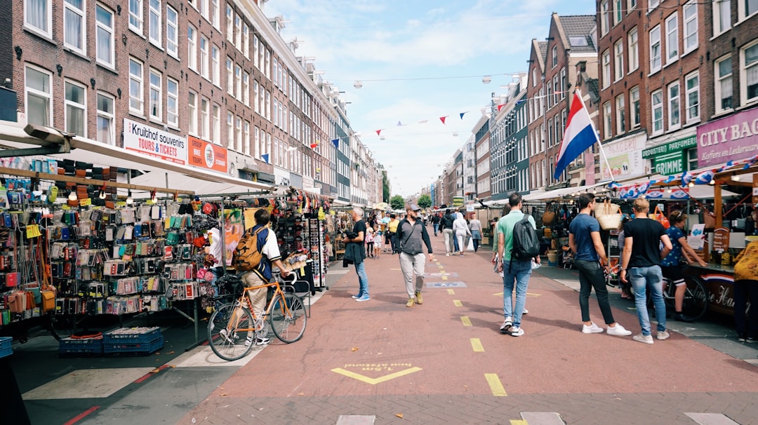Tourists navigating a crowded market street where theft is common