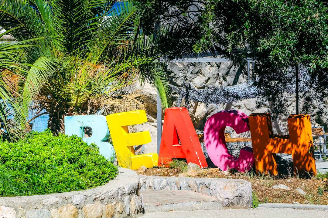 Colorful beach town with tropical buildings and palms