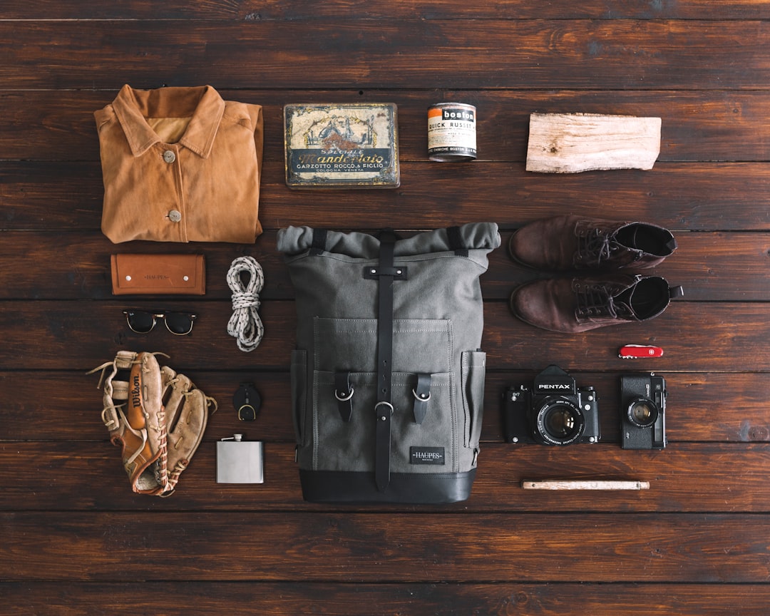 Three travel backpacks compared in flat lay arrangement