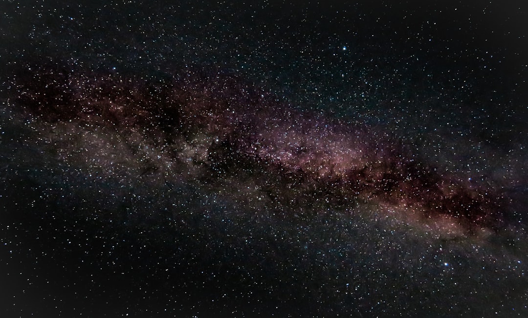 The Milky Way galaxy stretching across a dark sky