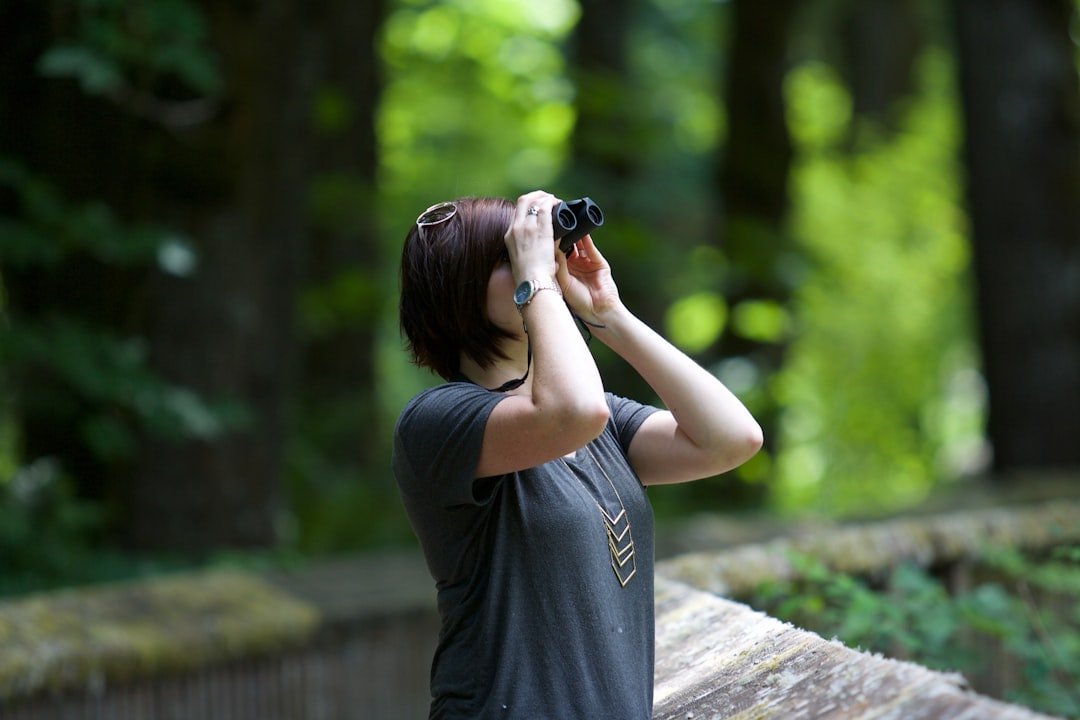Wildlife watching with binoculars in nature