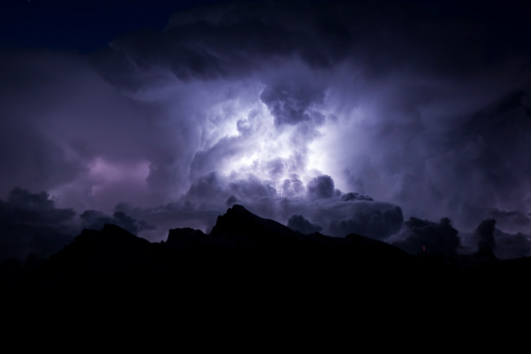 Lightning splitting the desert sky at dusk