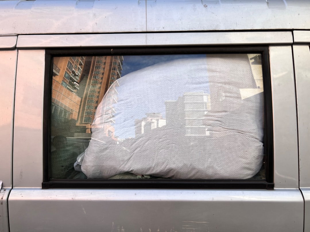 Reflective window cover blocking sunlight in camper van