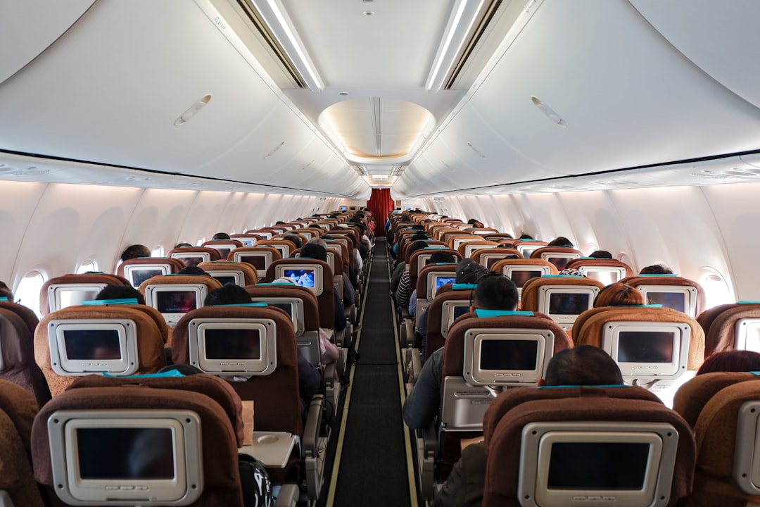 Airplane cabin interior with seats and overhead bins