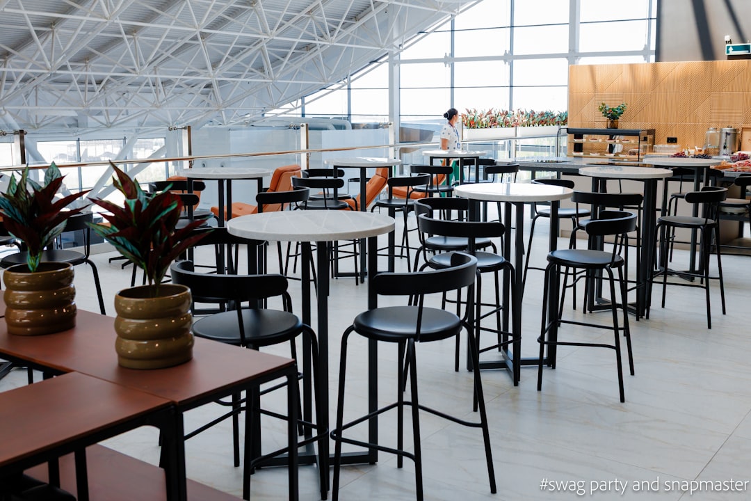 Quiet airport lounge interior with seating and workspace