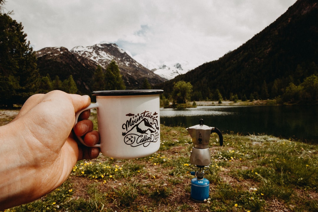 Steam rising off a hot coffee mug on a frosty morning outdoors
