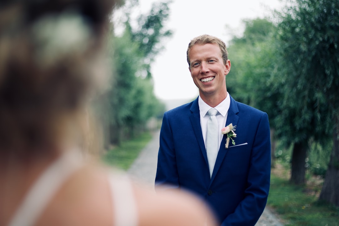 Wedding guest in a navy suit on the day of the ceremony