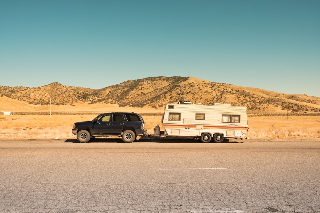 RV trailer hitch and leveling setup at campsite