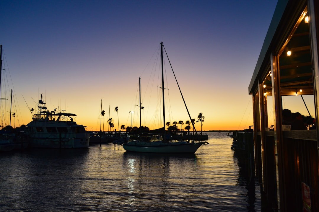 Marina at sunset with boats moored along Florida coastline