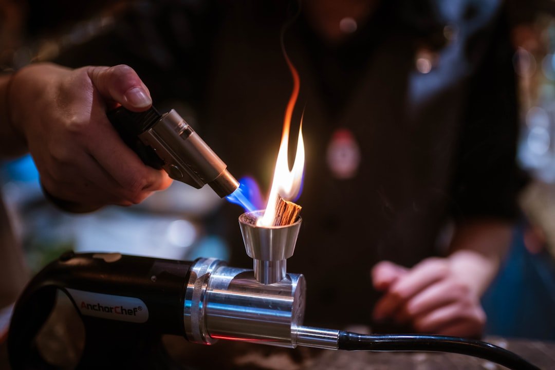 Butane torch applying heat to shrink tubing on wire connections