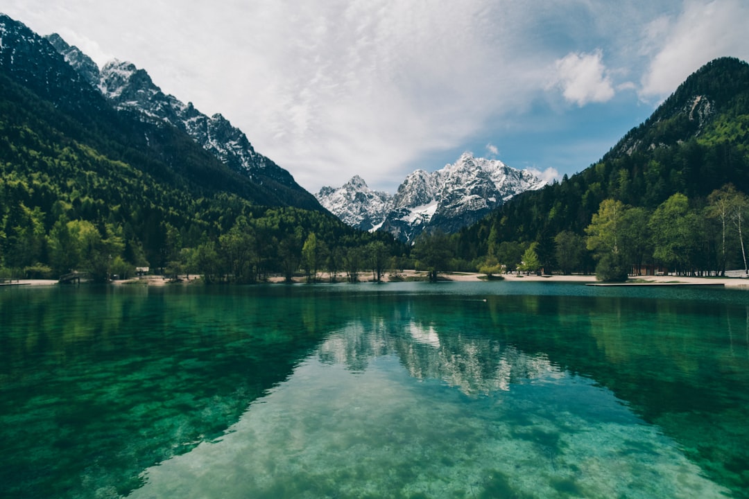 Turquoise mountain lake reflecting granite peaks