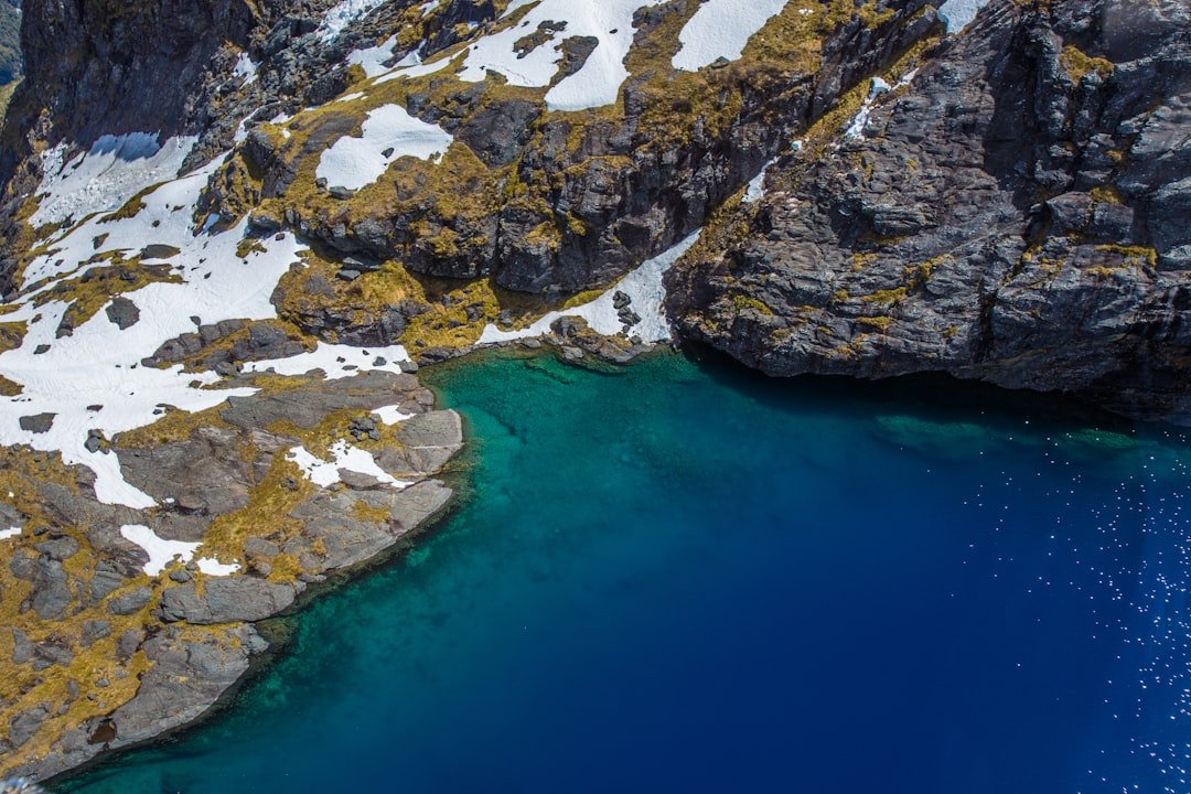 Crystal clear turquoise spring water welling up from a spring basin