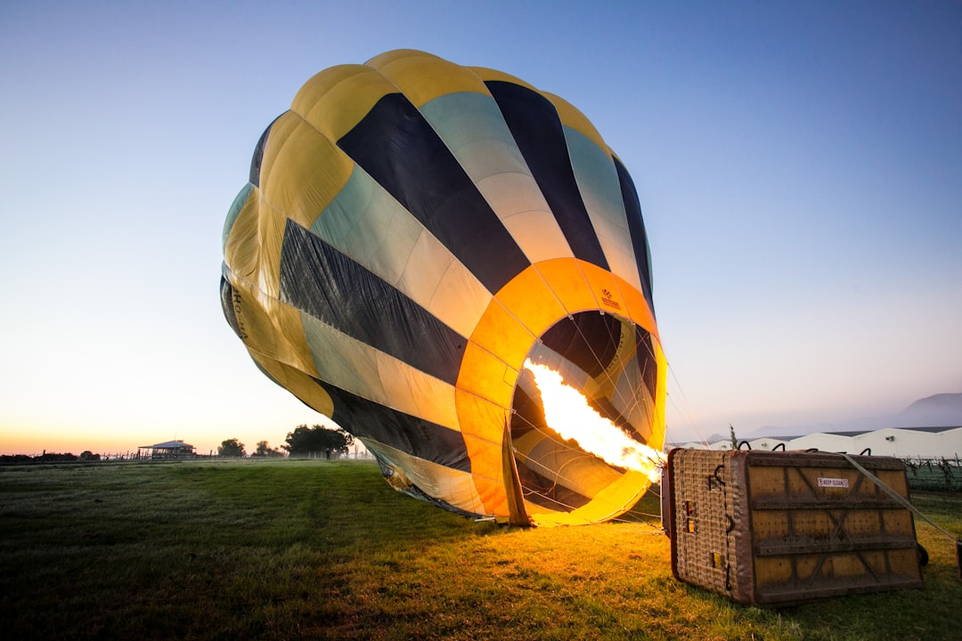 Hot air balloon envelope inflating with burner flame visible