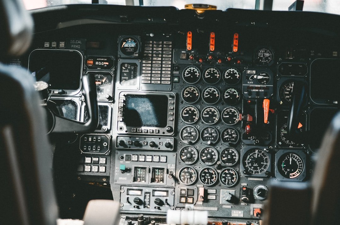 A vintage instrument panel full of round analog gauges in a small airplane