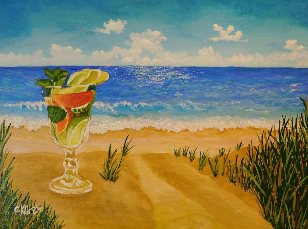 Fresh fruit smoothie in a glass with tropical backdrop