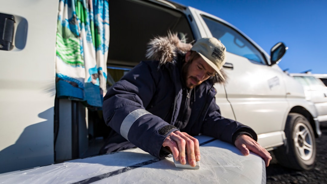 Installing insulation in campervan walls during build