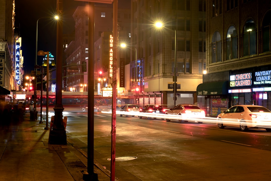 Historic downtown street glowing with neon at night