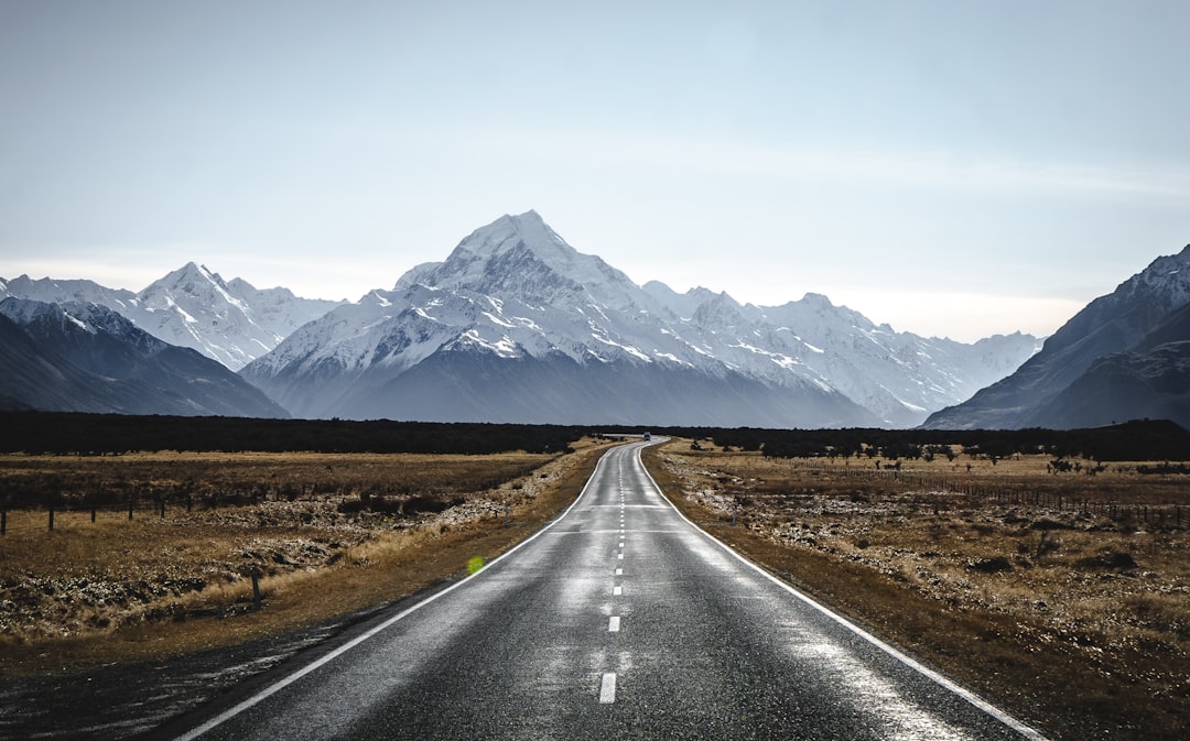 Snowy mountain road stretching through a winter pass