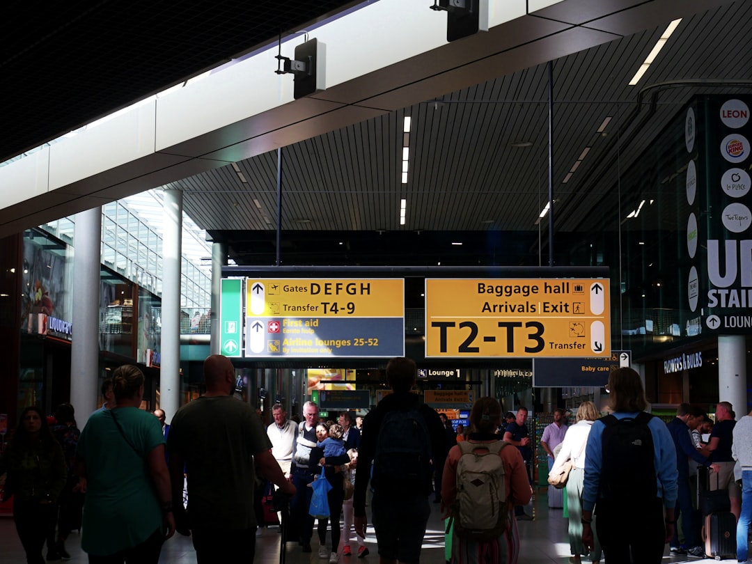 Departure board glowing in a quiet airport at night