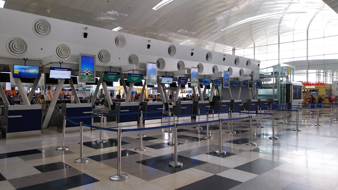 Airline customer service counter where agents rebook stranded passengers