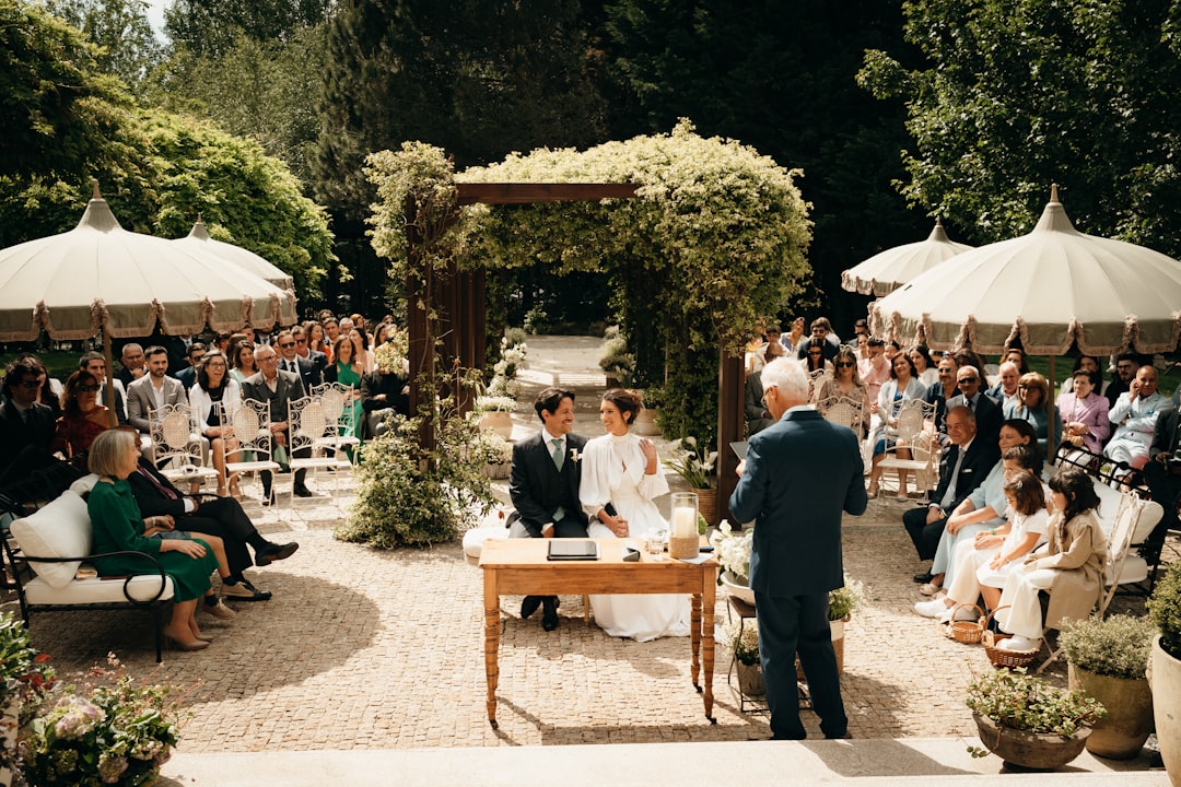 Guests seated at an outdoor wedding ceremony