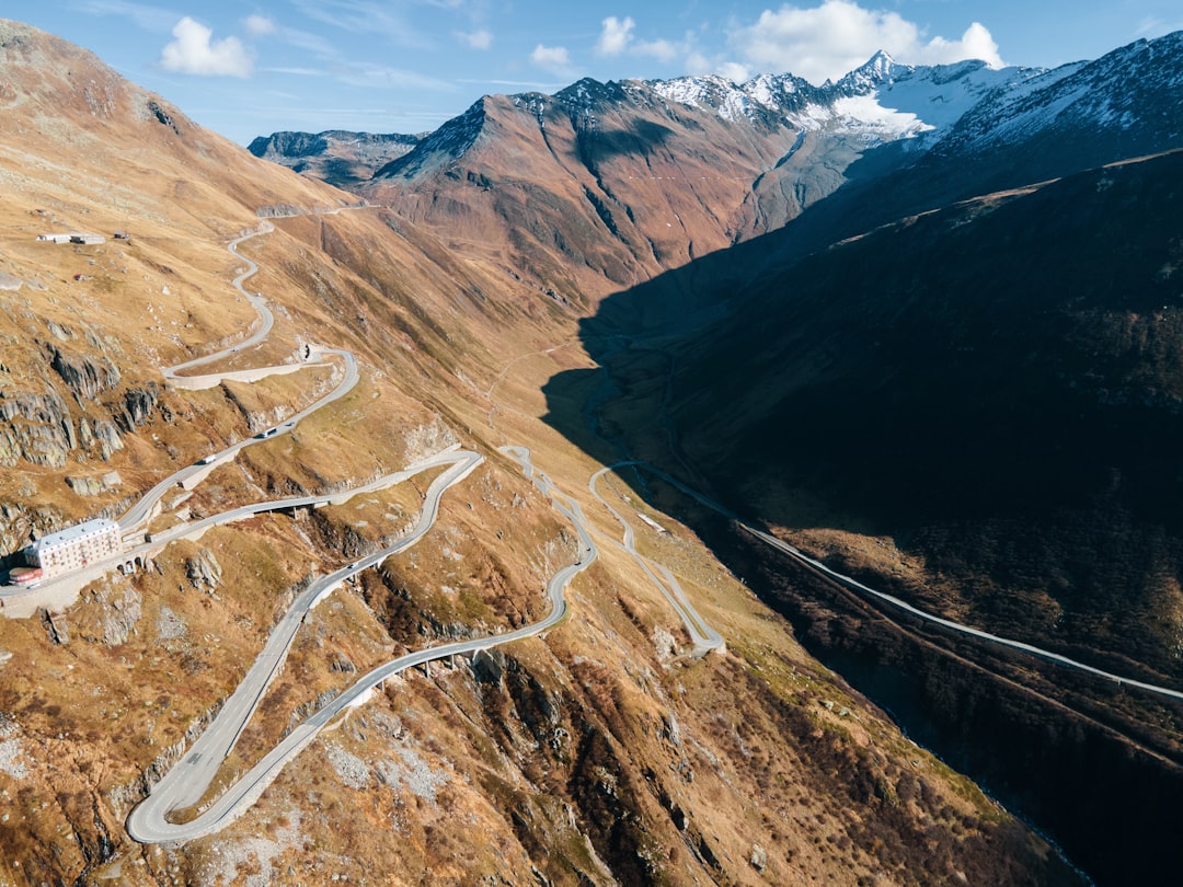 Mountain road switchbacks carved into the San Juan Mountains along the Million Dollar Highway