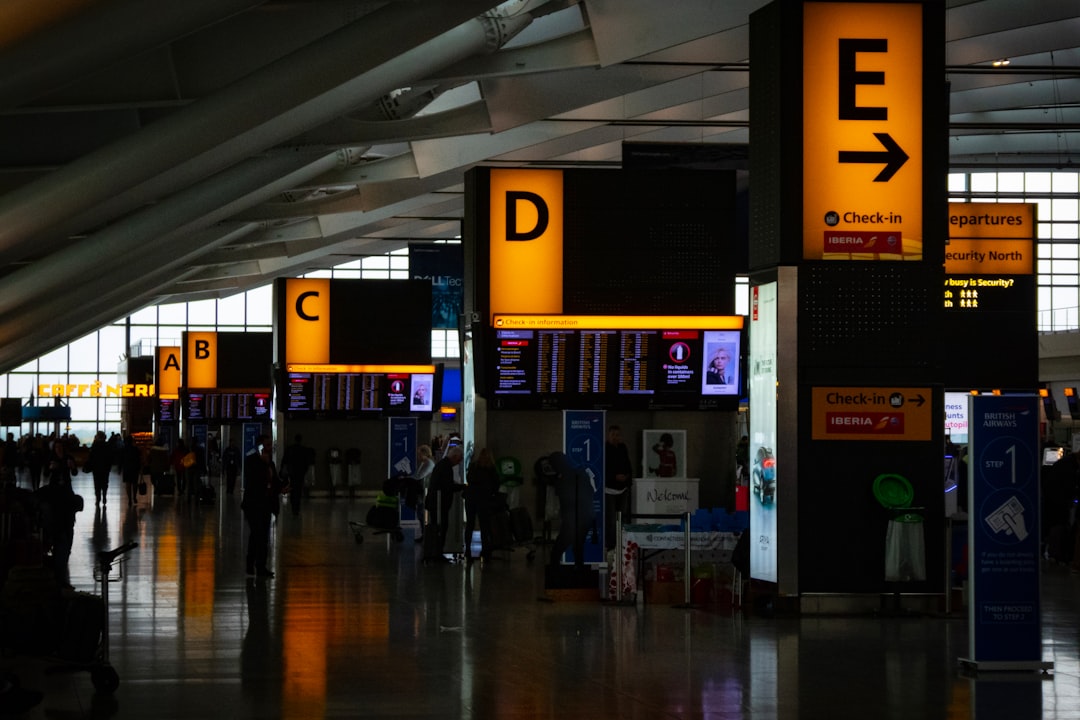 Traveler resting overnight in a dim airport terminal
