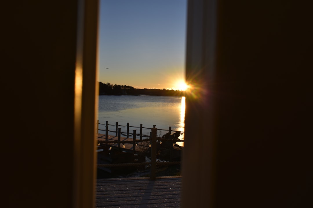 Winery porch overlooking a lake at sunset