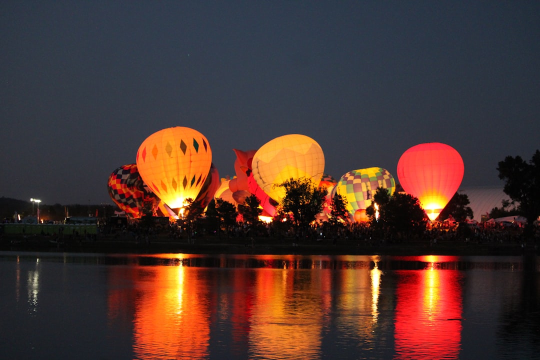 Hot air balloons glowing at night