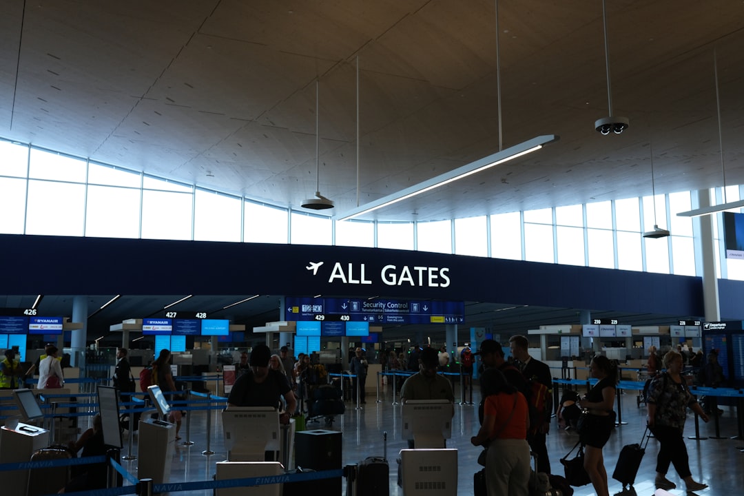 Crowded airport terminal gate area filled with waiting travelers
