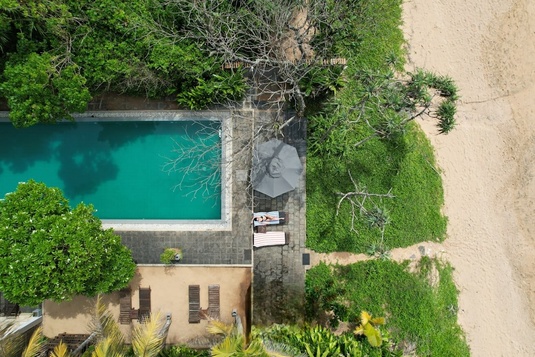 Aerial view of beachfront villa with pool