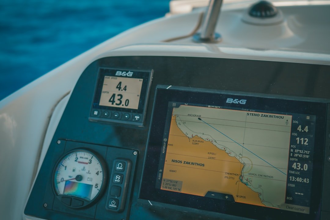 Marine GPS chartplotter display showing navigation data on boat helm
