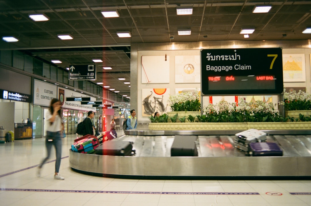 Luggage carousel at baggage claim — a place personal-item travelers skip