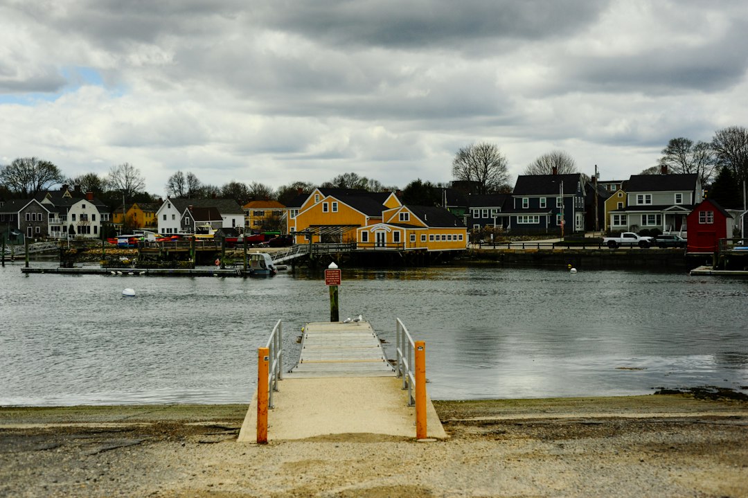 Quiet lakeside harbor town under an overcast fall sky