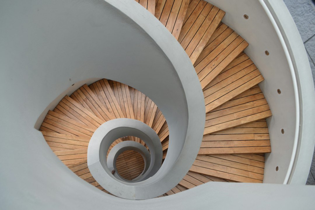 Spiral staircase viewed from above, stairs curving upward