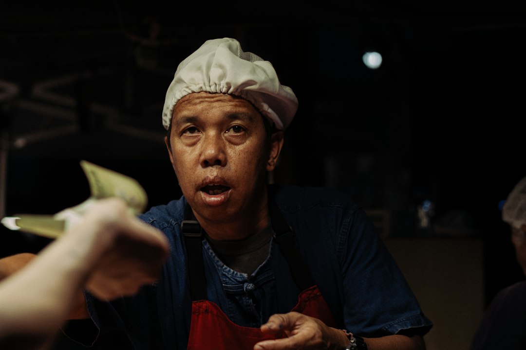 Market vendor receiving cash from a customer