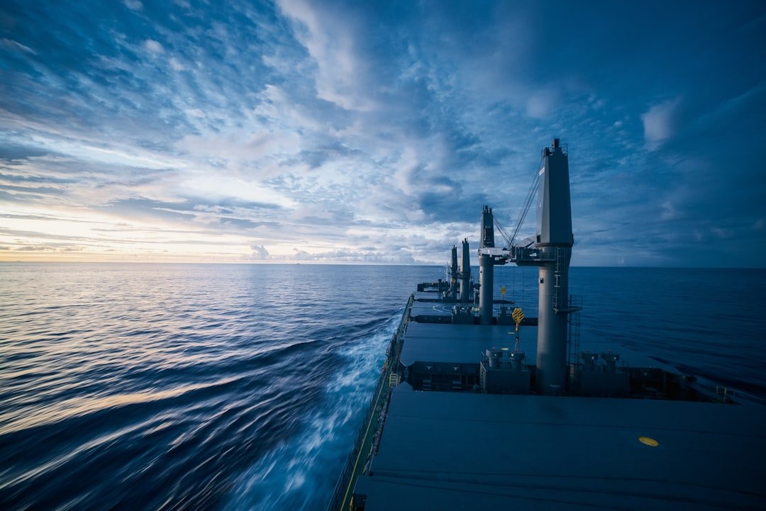 Ship's white wake stretching across the open ocean