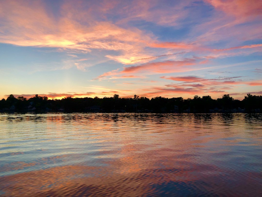 Golden sunset light reflecting across calm open water