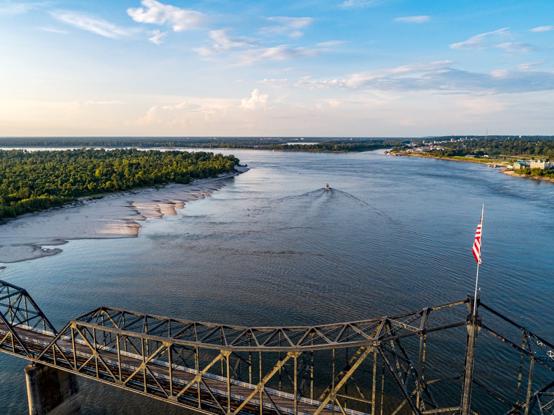 Aerial view of the Mississippi River with a steel truss bridge