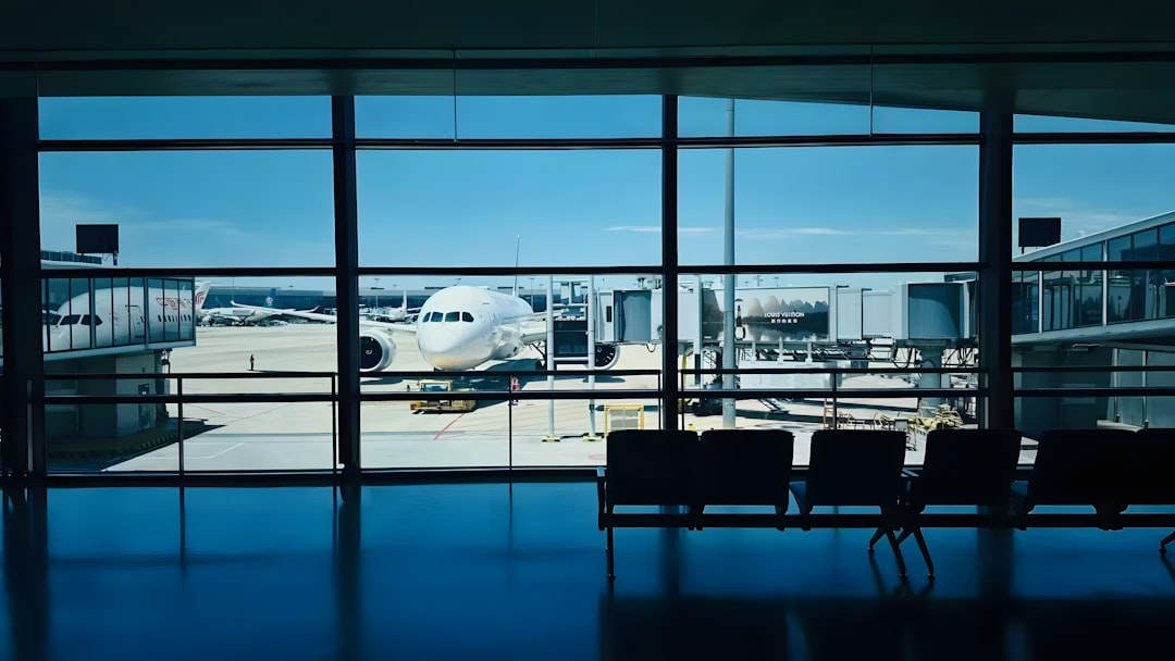 Travelers waiting at an airport departure gate