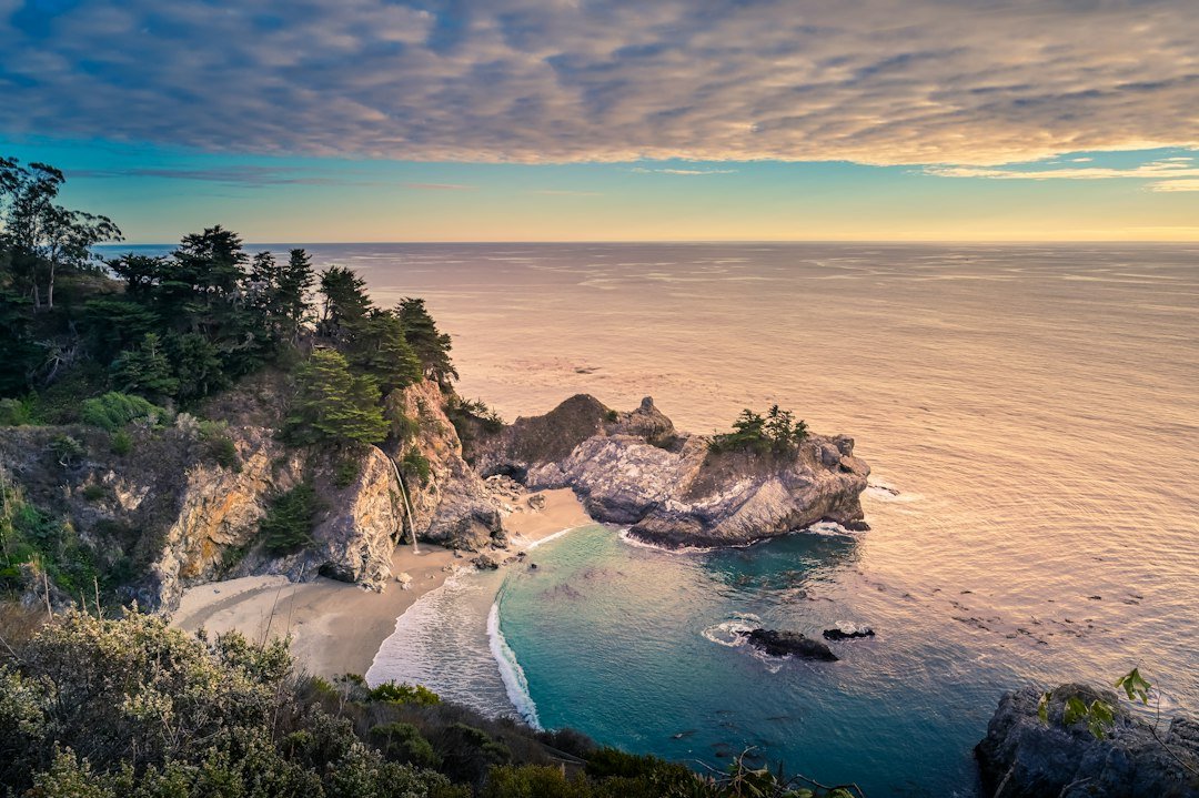 McWay Falls dropping onto a pristine cove beach beside the Pacific