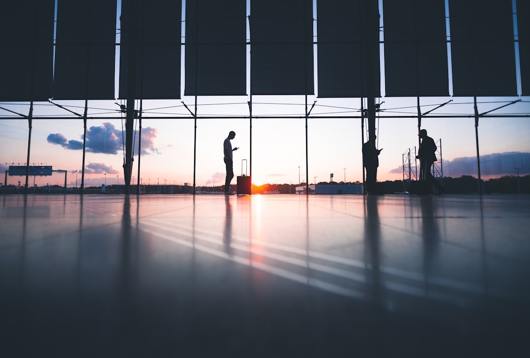 Airplane at an airport gate at sunset