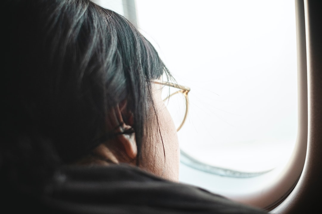 Traveler sleeping peacefully in a window seat