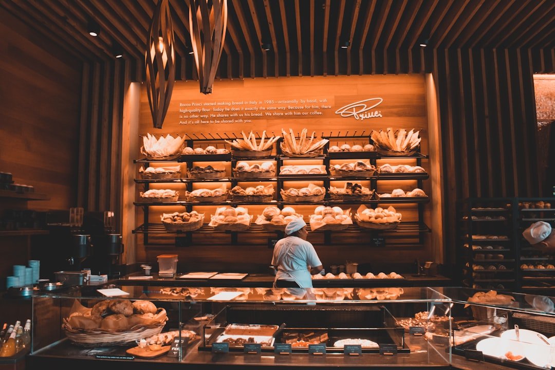 Artisan bread loaves on display at a market bakery counter