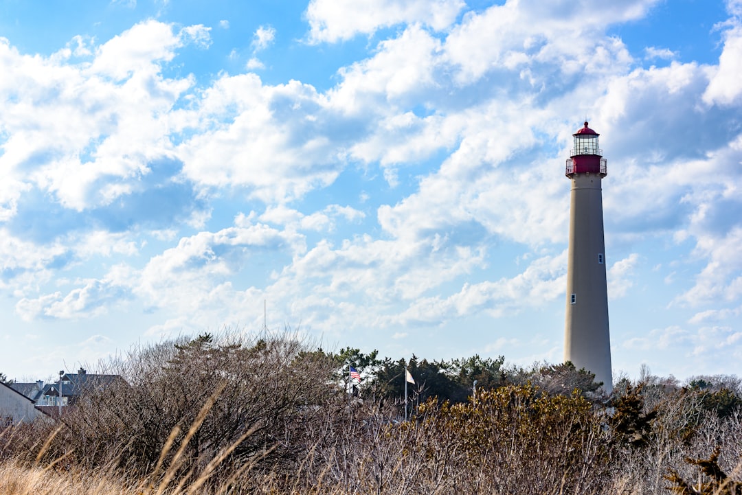 Cape May lighthouse under a partly cloudy sky